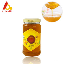 Raw polyflower honey with glass jar